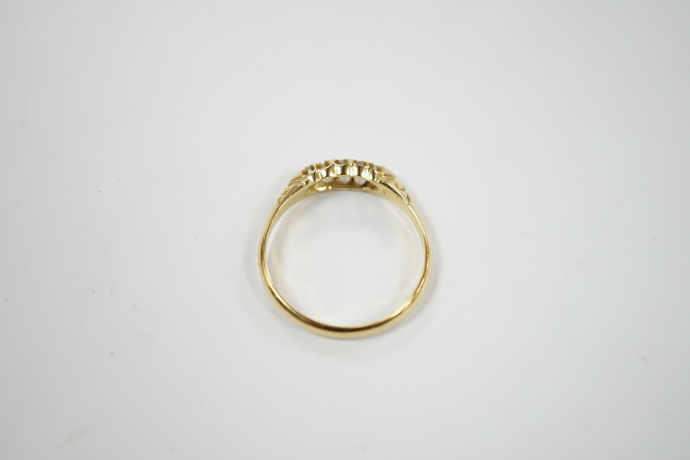 A Victorian 18ct gold and graduated five stone diamond chip set half hoop ring, size X, gross weight 3.6 grams.